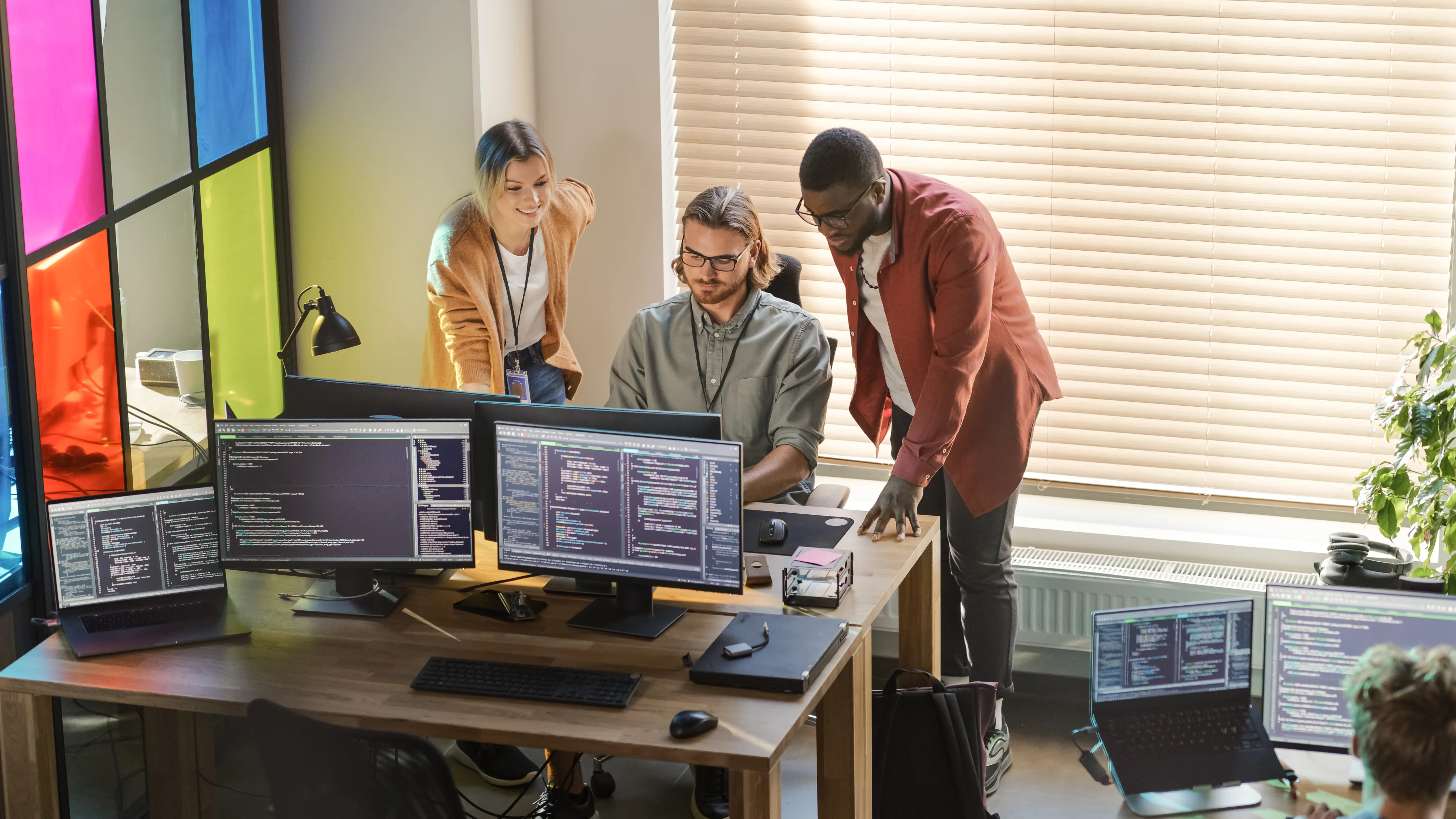 Guy programming and helping others
